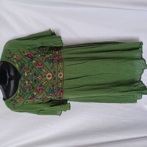 Peasant style dress with gypsy bell sleeves in olive green in size medium lined